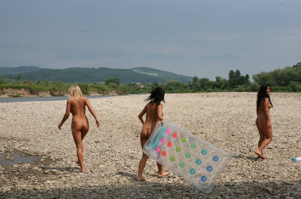 Naturist Park Floating On River photos - Nudity is a natural part of life for some people on the planet