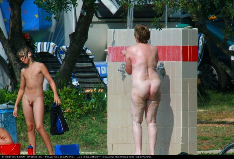 Covered in Towel Nudists-Boardwalk Biking - The practice of naturism fosters inner harmony