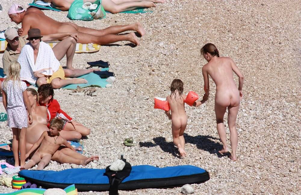 Orange Floaty Safety First Naturist pics - Radical nudism materials